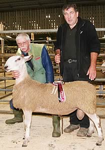 David Lodge, Otley, left, is pictured with his Skipton multi-breed Blue Faced Leicester champion, joined by judge Ken Dickinson, Skipton.