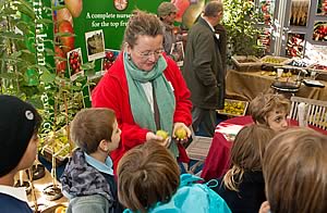 Sarah Calcutt, Chairman of the Marden Fruit Society, explaining the differences between different varieties of apples