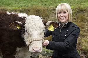 Diane Harrison, Cattle Secretary with her Hereford Calf