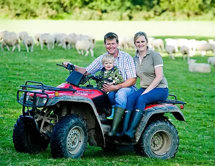 Hosts of the event Sion Williams, his wife Claire, and their small son Harri 