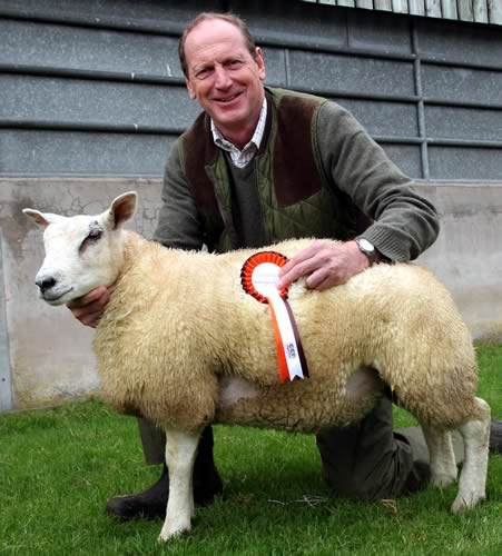 Craven Cattle Marts chairman Anthony Hewetson is pictured with lamb he donated and sold on behalf of national farming charity, the Addington Fund.